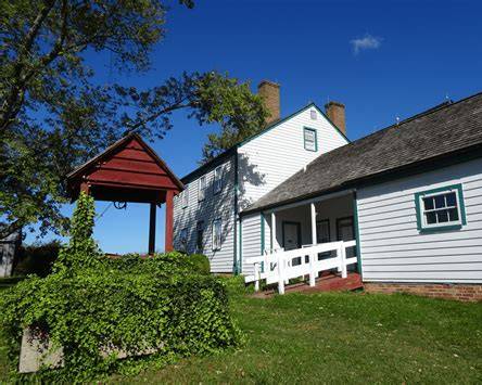 Historic farm buildings and well house at Thomas Stone National Historic Site in Charles County Maryland
