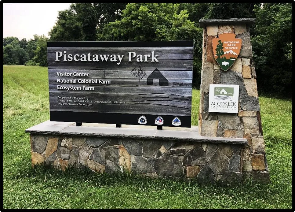 Stone entrance sign for Piscataway Park visitor center and National Colonial Farm in Accokeek Maryland